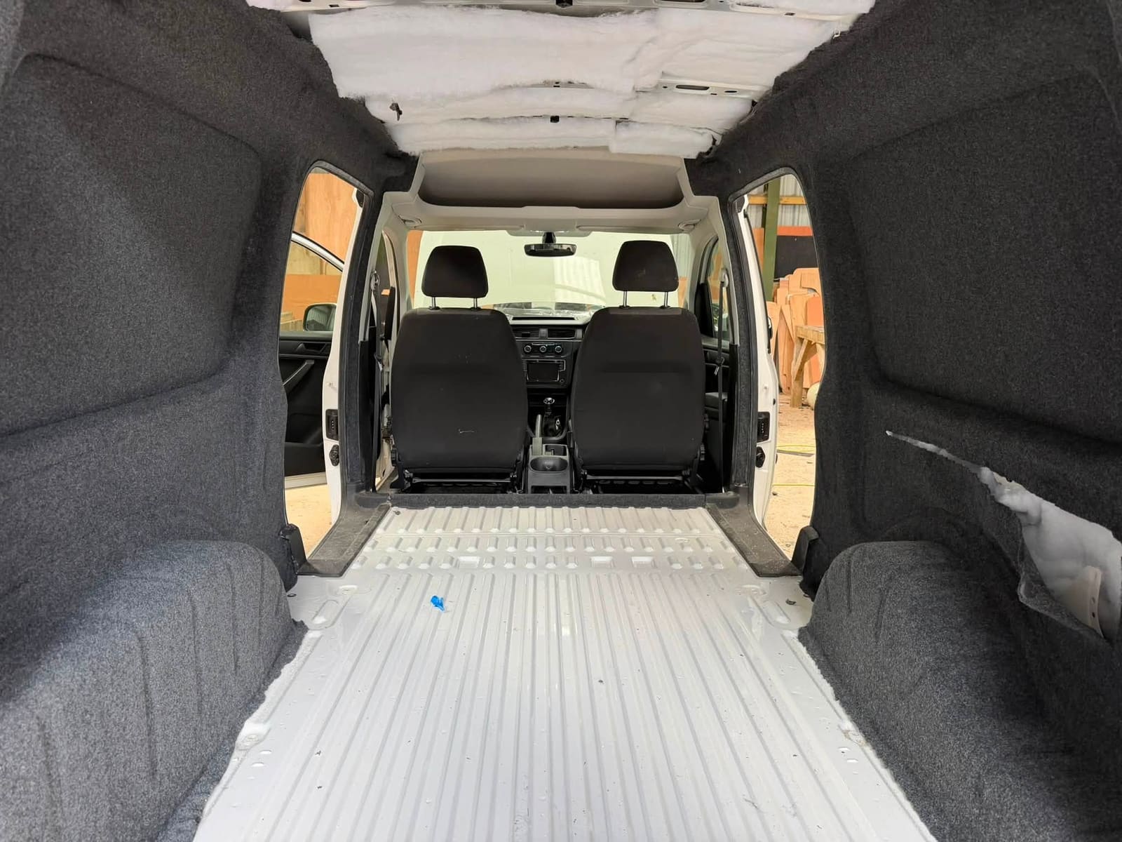 VW Caddy interior after carpet lining, flooring and lighting