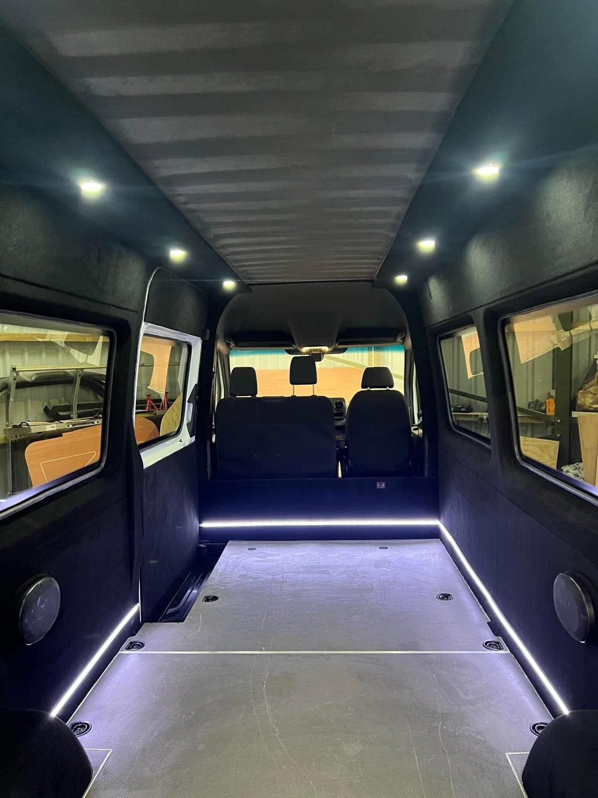 Finished Mercedes Sprinter interior, carpet-lined with LED spot and floor lighting