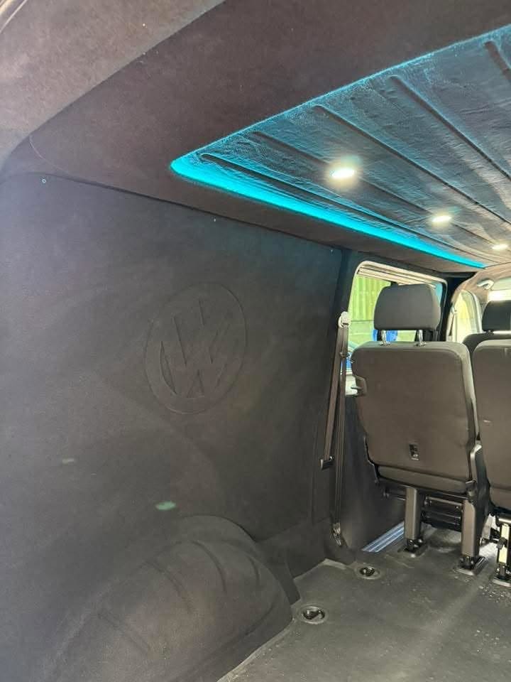 Embossed VW badge detailing in a carpet-lined panel